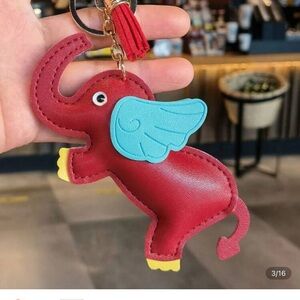 Whimsical Red Elephant Keychain with Blue Wings